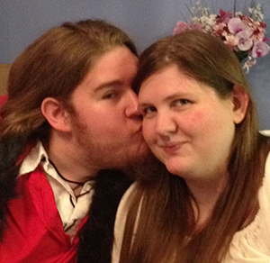 Sei’ne Heasley kissing his wife, Ashley Marie